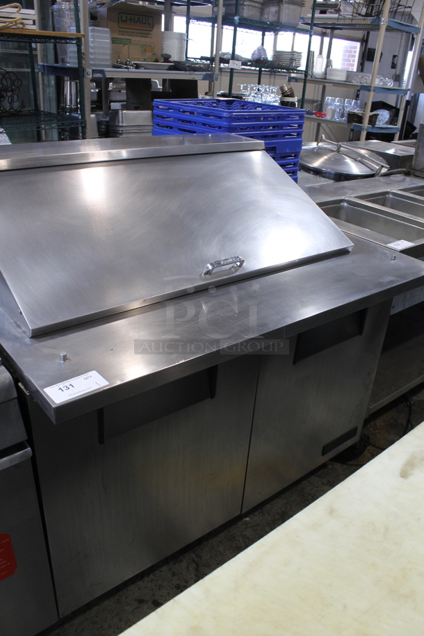 2012 True TSSU-48-18M-B Stainless Steel Commercial Sandwich Salad Prep Table Bain Marie Mega Top on Commercial Casters. 115 Volts, 1 Phase. Tested and Powers On But Does Not Get Cold