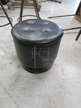 One Black Metal Swivel Stool/Ottoman With A Black Cushioned Seat. 17X15.5