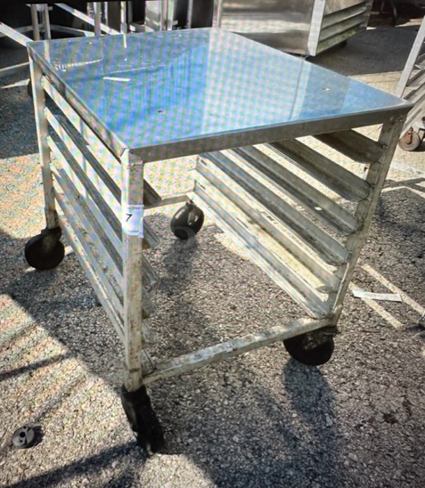One Aluminum Speed Rack With A Stainless Steel Top On Casters. 21X26.5X26