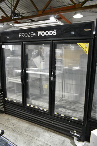 2017 True GDM-72F-HC Metal Commercial 3 Door Reach In Freezer Merchandiser w/ Poly Coated Racks. 115/208-230 Volts, 1 Phase. 