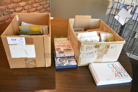 ALL ONE MONEY! Lot of 2 Boxes of Various Items Including Greeting Cards. (booth room) 