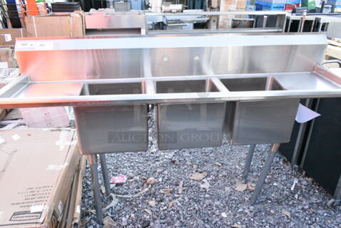 Regency 600S31515215 Stainless Steel Commercial 3 Bay Sink w/ Dual Drain Boards. Bays 15x15x12. Drain Boards 13x17