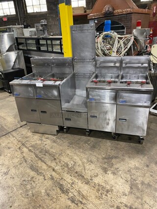 GREAT! Pitco Frialator 4 Bay Natural Gas Powered Commercial Deep Fat Fryer! With Middle Dump Station! With 8 Frying Baskets! With Oil Filter System! All Stainless Steel! MODEL: SGH50 SN: G11BD005229! 115V! On Casters!