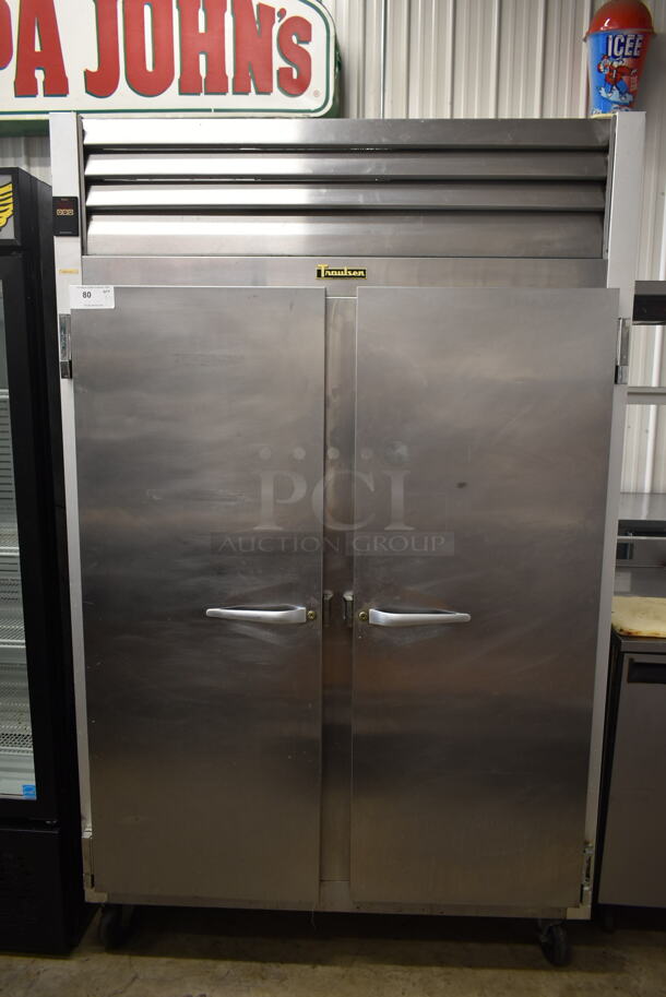 Traulsen G20010 Stainless Steel Commercial 2 Door Reach In Cooler w/ Poly Coated Racks on Commercial Casters. 115 Volts, 1 Phase. Tested and Powers On But Does Not Get Cold