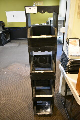 Black 4 Tier Display Rack. (main dining room)