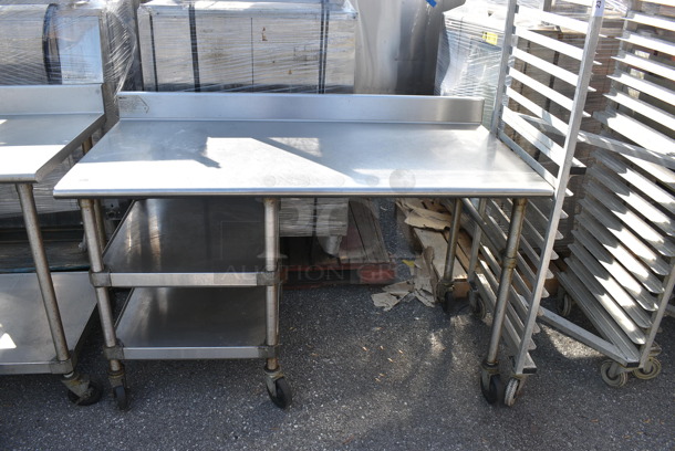 Commercial Stainless Steel Utility Cart With 2 Undershelves On Commercial Casters.