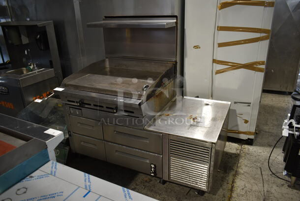 Stainless Steel Commercial Gas Powered Flat Top Griddle w/ Montague Stainless Steel 4 Drawer Chef Base on Commercial Casters.