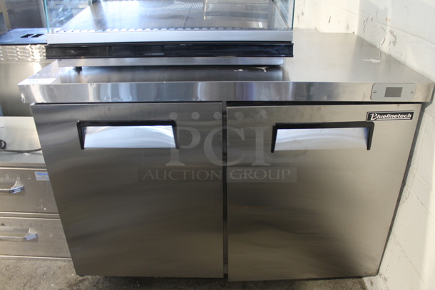 BRAND NEW SCRATCH AND DENT! Bluelinetech BUC48FA Stainless Steel Commercial 2 Door Undercounter Freezer. 115 Volts, 1 Phase. Tested and Working!