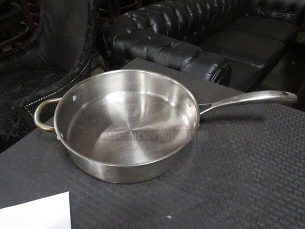 One Stainless Steel Wofgang Puck 11 Inch Sauce Pan. 