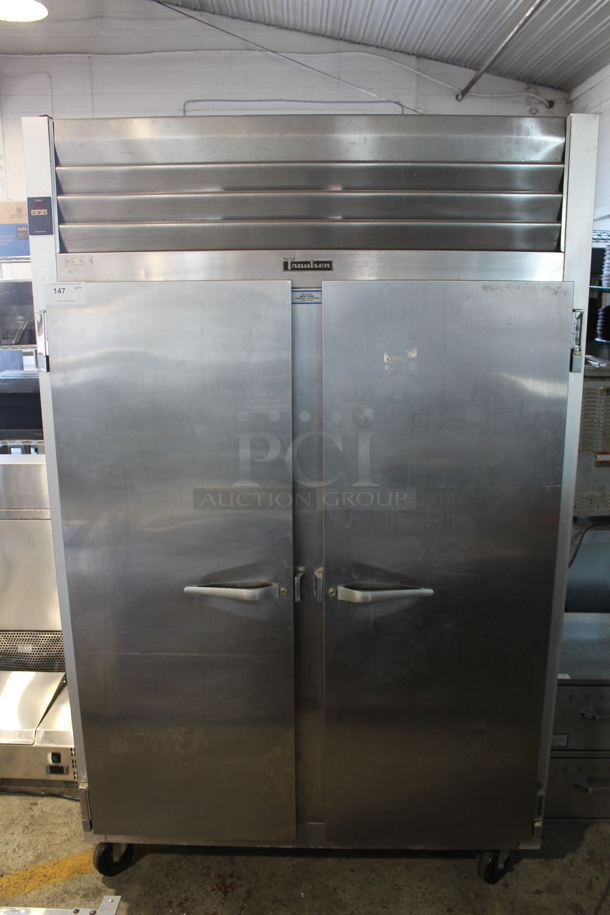 Traulsen G20010 Stainless Steel Commercial 2 Door Reach In Cooler w/ Poly Coated Racks on Commercial Casters. 115 Volts, 1 Phase. Tested and Powers On But Does Not Get Cold