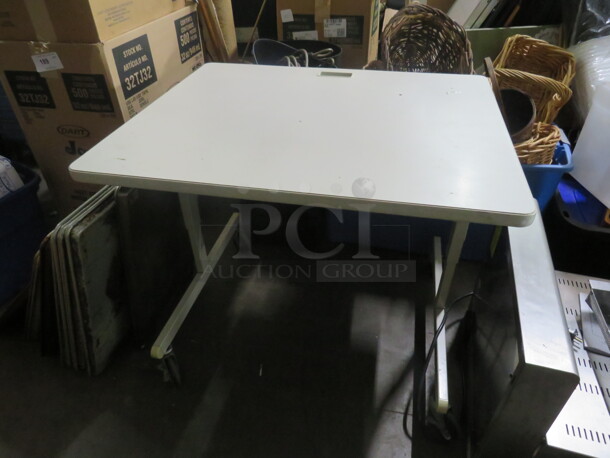 One Laminate Top Table/Desk On A Metal Base On Casters. 36X30X30