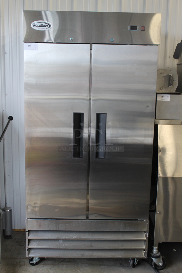 BRAND NEW SCRATCH AND DENT! 2022 KoolMore RIR-2D-SS35C Stainless Steel Commercial 2 Door Reach In Cooler w/ Poly Coated Racks on Commercial Casters. 115 Volts, 1 Phase. Tested and Working!