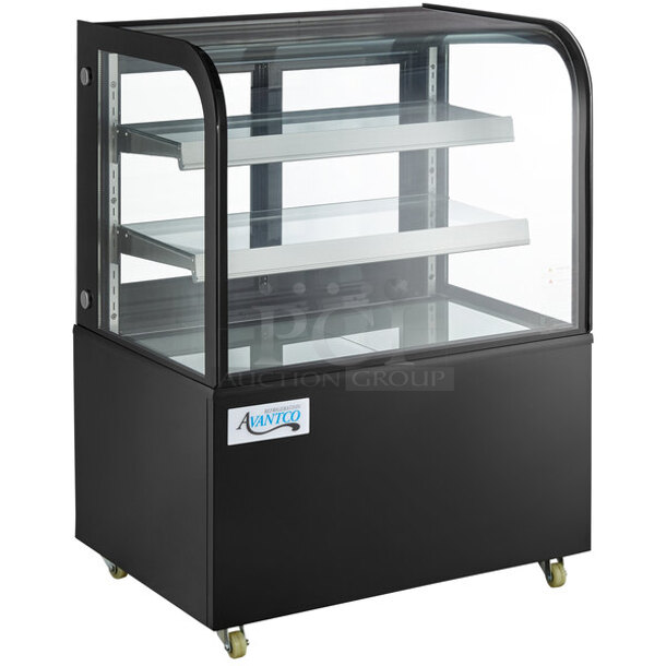 Avantco BC-36-HC 36" Curved Glass Black Refrigerated Bakery Display Case On Commercial 2" Casters With Adjust Glass Shelves & LED Lighting. Tested. Works Perfect. Exterior/Outer Glass is Damaged on Right Side. Interior Glass Is Fine. See Photos.