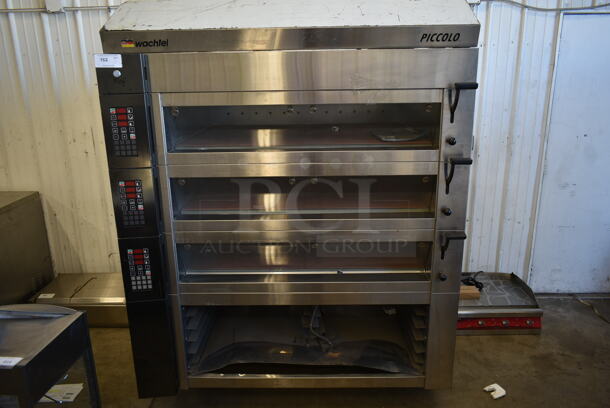 BRAND NEW SCRATCH AND DENT! 2012 Wochtel Piccolo II-3 Basic Stainless Steel Commercial Electric Powered Triple Deck Bakery Oven Pizza Oven w/ Cooking Stones on Commercial Casters. 220 Volts, 3 Phase.
