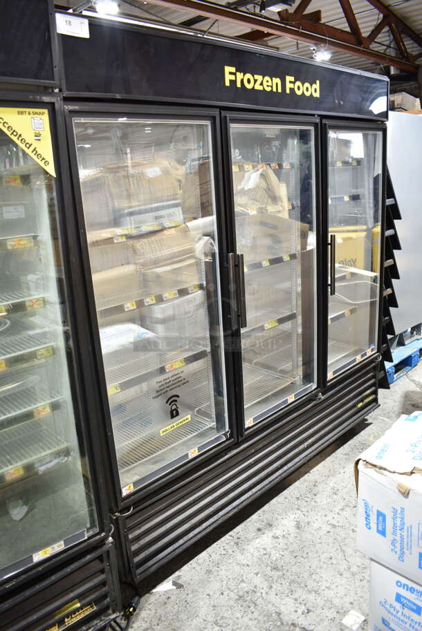 2015 True GDM-72F-LD ENERGY STAR Metal Commercial 3 Door Reach In Freezer Merchandiser w/ Poly Coated Racks on Commercial Casters. 115/208-240 Volts, 1 Phase. Tested and Working!