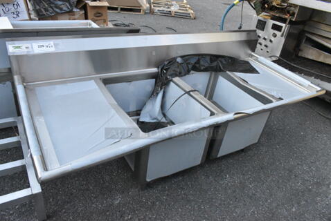 BRAND NEW SCRATCH AND DENT! Regency 600S21824218 Stainless Steel Commercial 2 Bay Sink w/ Dual Drain Boards. No Legs. Bays 18x24. Drain Boards 16.5x26