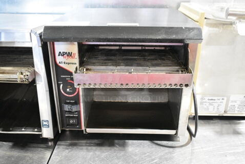 APW Wyott AT EXPRESS Stainless Steel Commercial Countertop Conveyor Toaster Oven. 120 Volts, 1 Phase. 