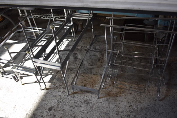 ALL ONE MONEY! Lot of Items Under Table Including 11 Various Metal Stands. Includes 8x24x3.5, 13x22x22, 9x15x18