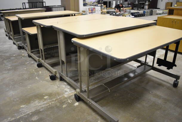 Adjustable Height Desks With Faux Wood Top. 5 Times Your Bid! (Main Building)