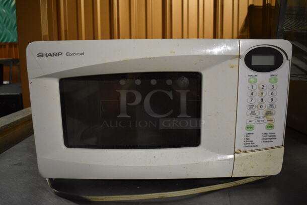 Sharp Carousel R-220KW Metal Countertop Microwave Oven w/ Plate. 18x13x11. Item Was in Working Condition on Last Day of Business. (lounge)