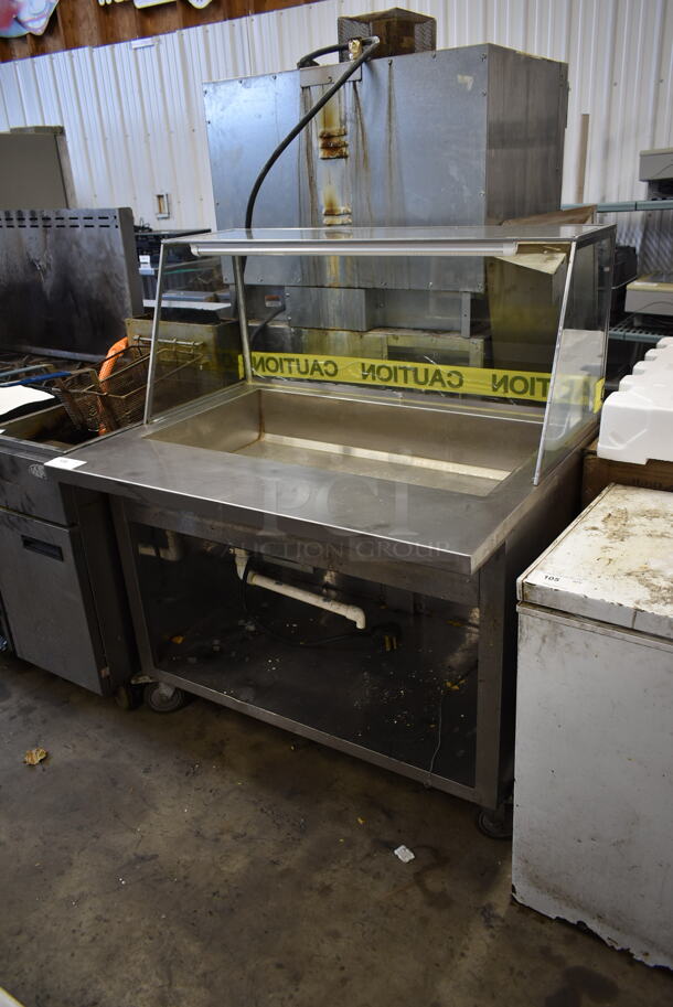 Stainless Steel Commercial Floor Style Steam Table w/ Sneeze Guard and Under Shelf on Commercial Casters. Cannot Test Due To Plug Style