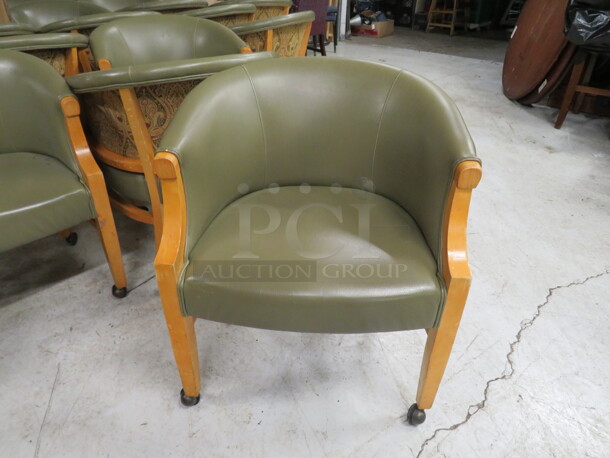 One Wooden Barrel Back Chair With Green Tapestry Cushioned Back And Green Pleather Cushioned Seat On Casters. 2XBID