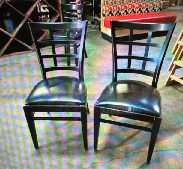 Black Wooden Chair With A Balck Cushioned Seat. 3XBID