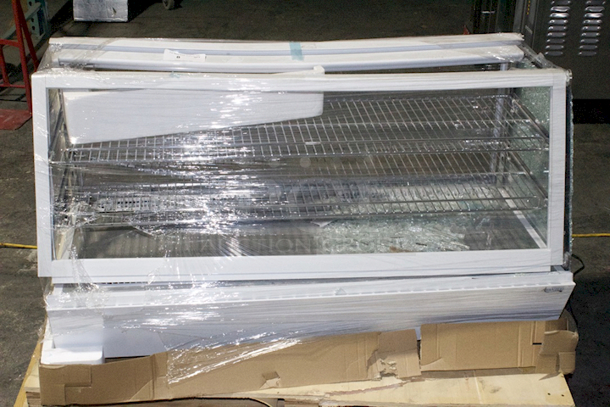 BRAND NEW SCRATCH & DENT! Avantco BCSS-48-HC 48" White Self-Serve Refrigerated Countertop Bakery Display Case with LED Lighting. Tested. Turns On & Works. S/N: 1356406100129 Glass completely shattered. Frame is broken. See Photos For Damage. 48 x 22 3/8 x 27	 