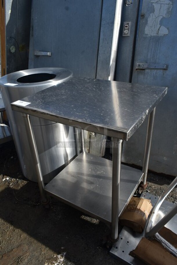 Stainless Steel Table w/ Under Shelf on Commercial Casters.