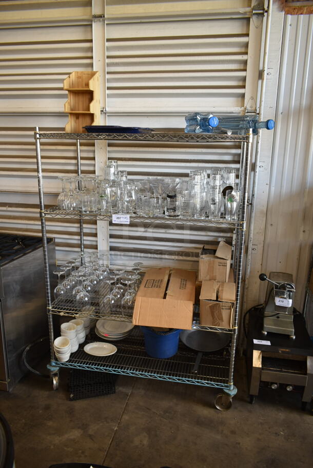 ALL ONE MONEY! Lot of Items on Shelving Unit Including Glasses and Dishes. Does Not Include Shelving Unit.