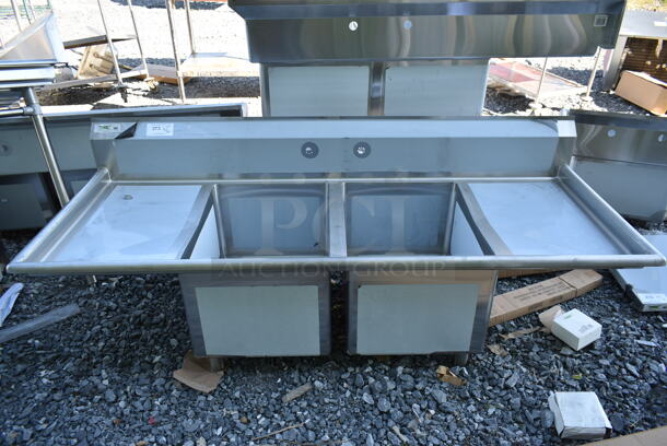 BRAND NEW SCRATCH AND DENT! Regency 600S21824218 Stainless Steel Commercial 2 Bay Sink w/ Dual Drain Boards. No Legs. Bays 18x24. Drain Boards 16.5x26 