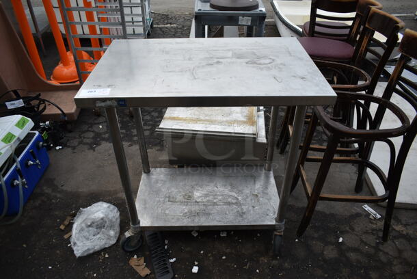 Stainless Steel Table w/ Metal Under Shelf on Commercial Casters