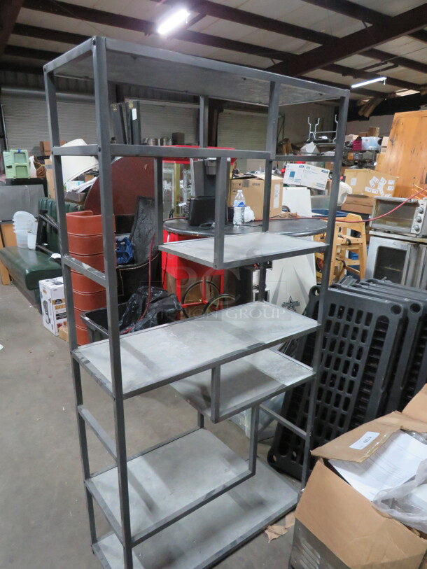 One Metal/Slate Shelving System With Assorted Size Shelves. 33X13X65.