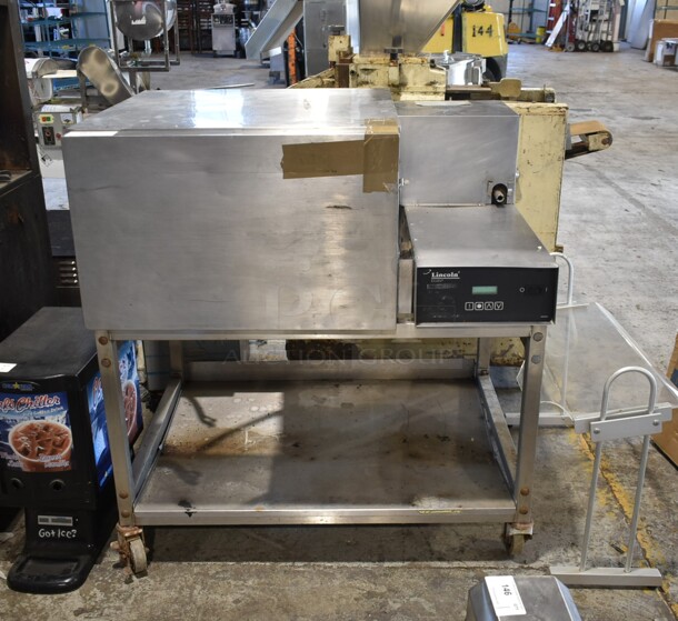 Lincoln Impinger Stainless Steel Commercial Electric Powered Single Deck Conveyor Pizza Oven on Commercial Casters Missing Conveyor. 3 Phase.