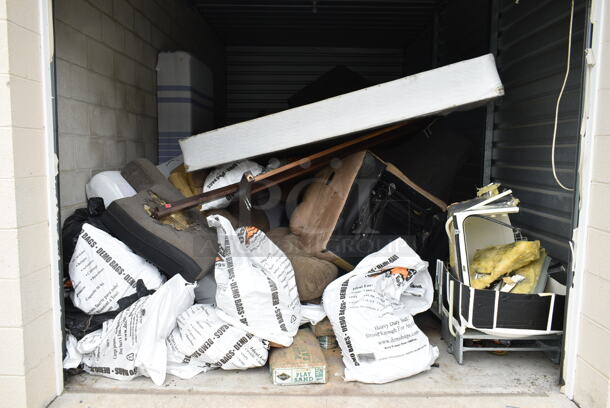 ALL ONE MONEY! Lot of Entire Contents of Storage Unit #41. Unit Size: 10'x20'. Unit Appears to Contain: Demo Bags, Multiple Couch Pieces, Mattresses, China Cabinet, Play Sand and Pieces of a Dishwasher. Cleaning Deposit of $100 per Unit Paid on Pickup Day. Winner Has 7 Days From Close of Auction to Remove Items. All Items Must Be Removed and Unit Must Be Broom Swept to Get Cleaning Deposit Returned.