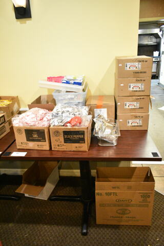 Wood Pattern Dining Height Table w/ Contents Including Salt Packets, Pepper Packets, Jams. (main dining room)