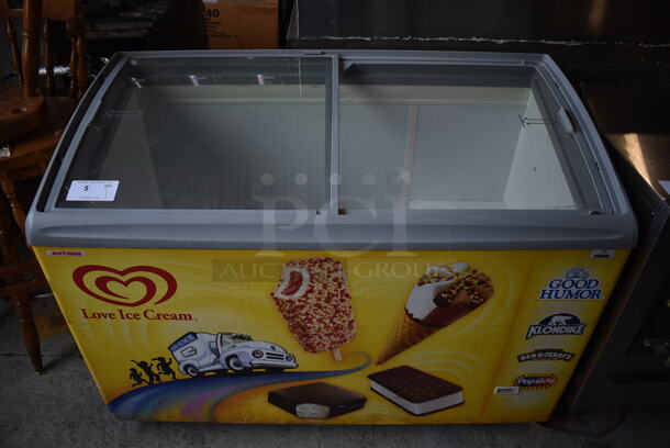 AHT Model RIO S 125 Metal Commercial Floor Style Novelty Ice Cream Freezer Merchandiser on Commercial Casters. 120 Volts, 1 Phase. 48x25x36. Tested and Powers On But Does Not Get Cold