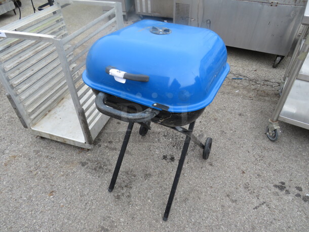 One Portable Charcoal Grill.