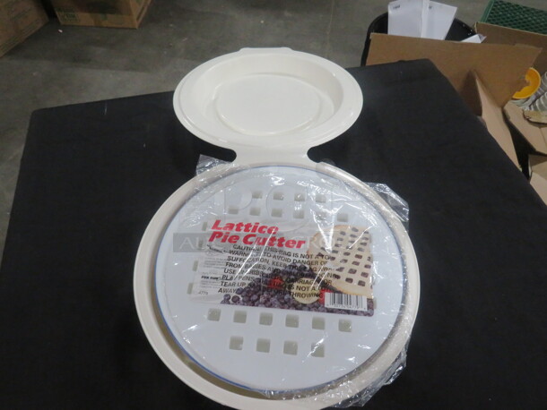One NEW Lattice Pie Cutter With Poly Container And Pie Plate.