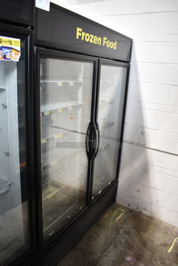 2018 True GDM-49F-HC ENERGY STAR Metal Commercial 2 Door Reach In Freezer Merchandiser w/ Poly Coated Racks. 115/208-230 Volts, 1 Phase. Tested and Working!