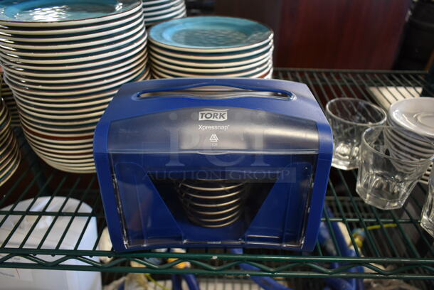 Tork Blue and Clear Poly Napkin Dispenser. 