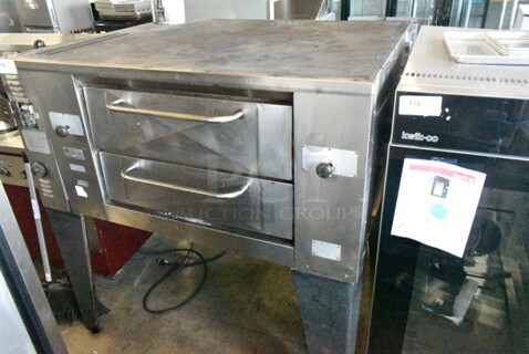 Bakers Pride GS805 Stainless Steel Commercial Natural Gas Powered Single Deck Pizza Oven on Metal Legs. 60,000 BTU.