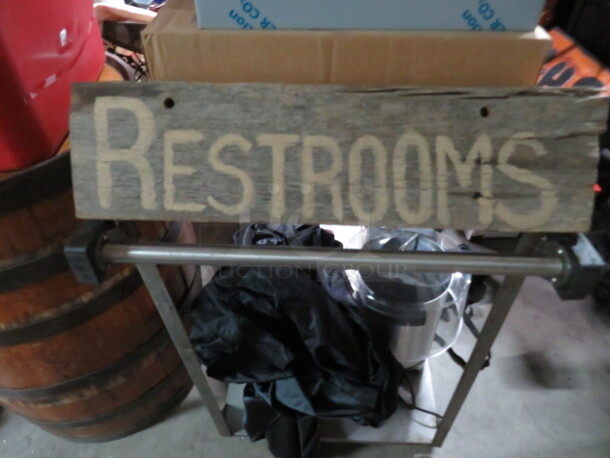 One Wooden Restroom Sign.