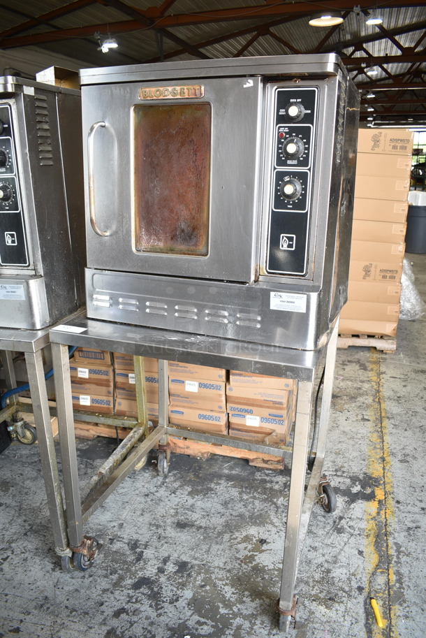 Blodgett Stainless Steel Commercial Natural Gas Powered Half Size Convection Oven w/ View Through Door, Metal Oven Racks, Thermostatic Controls and Equipment Stand on Commercial Casters. 