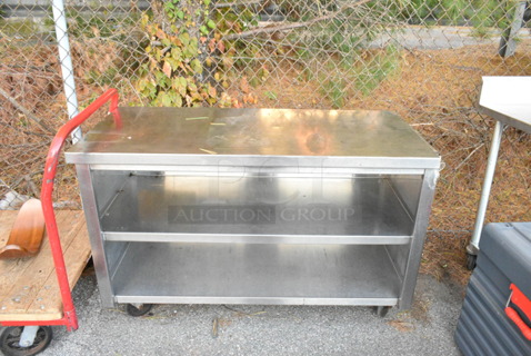 Stainless Steel Table w/ 2 Under Shelves on Commercial Casters. 