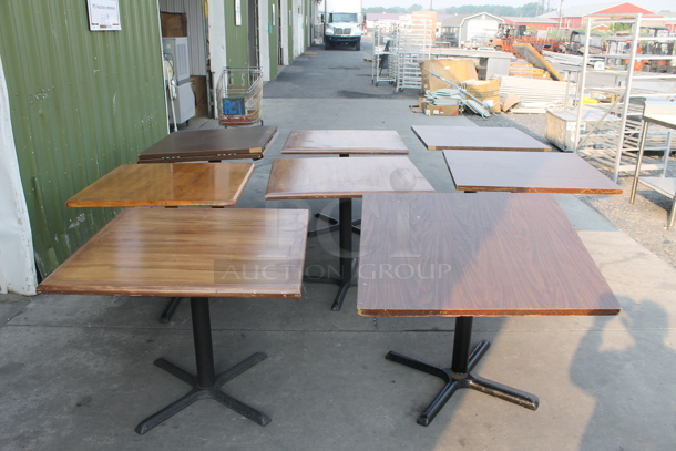 8 Square Wood Style Tables With Black X-Prong Table Base. 8 Times Your Bid! Cosmetic Condition May Vary.