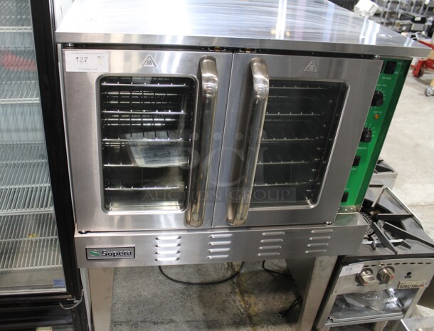 BRAND NEW! 2021 Supera PCO-1-N Stainless Steel Commercial Natural Gas Powered Full Size Convection Oven w/ View Through Doors, Metal Oven Racks and Thermostatic Controls on Metal Legs. 54,000 BTU. 