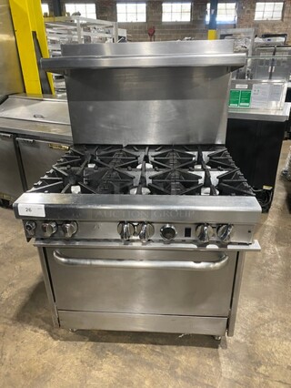 GREAT! Commercial Natural Gas Powered 6 Burner Stove! With full Sized Oven Underneath! With Backsplash & Overhead Salamander Shelf! All Stainless Steel! With Metal Oven Racks! On Legs! Model: 4361D SN: 11A17770!