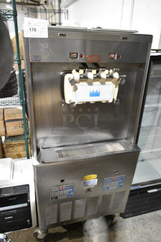 Taylor 339-33 Stainless Steel Commercial Floor Style 2 Flavor w/ Twist Soft Serve Ice Cream Machines on Commercial Casters. 208/230 Volts, 3 Phase. 