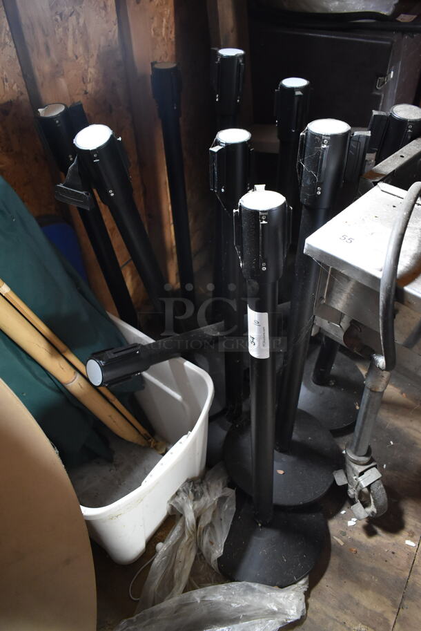 10 Black Stanchions. 10 Times Your Bid!  (outside shed)